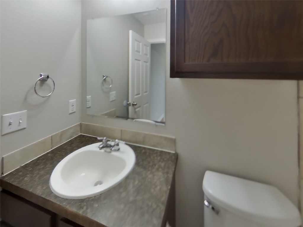 1027 Trail Driver Cove Georgetown, TX 78626 - Photo 7 of 17 Bathroom featuring vanity and toilet