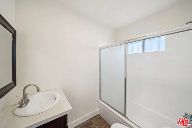a bathroom with a sink and mirror