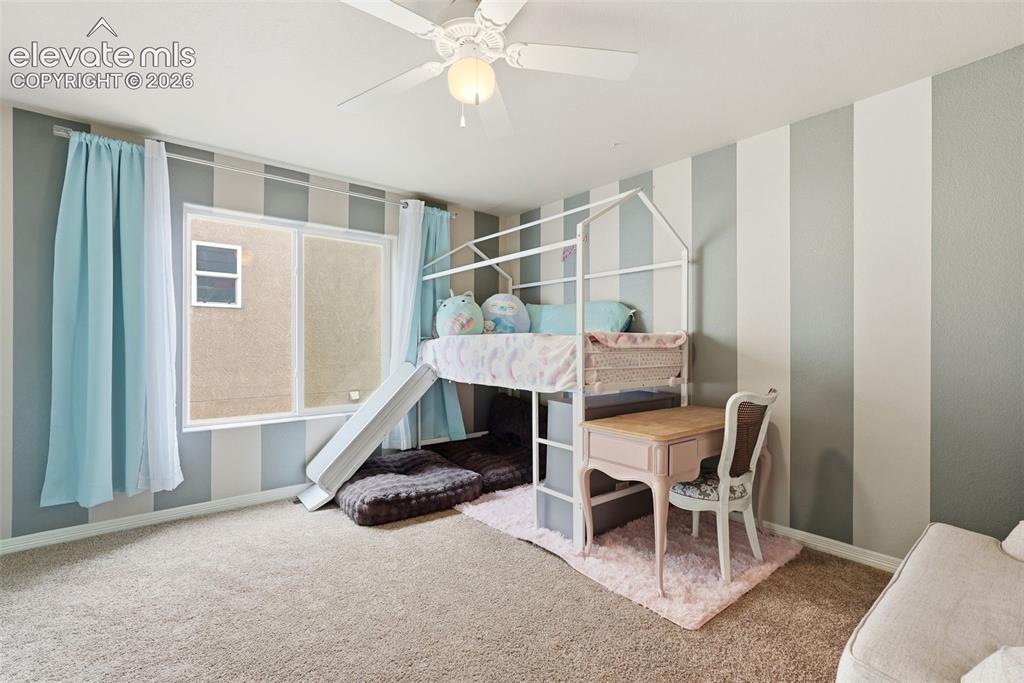 2264 Reed Grass Way Colorado Springs, CO 80915 - Photo 27 of 50 a bedroom with furniture and a window