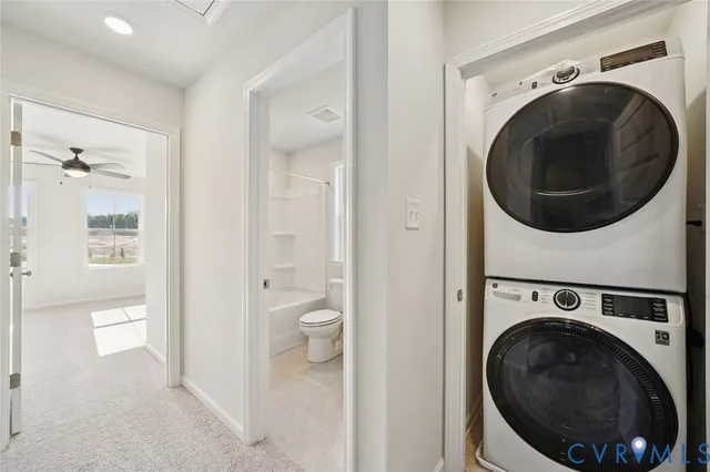 a view of a hallway with washer and dryer