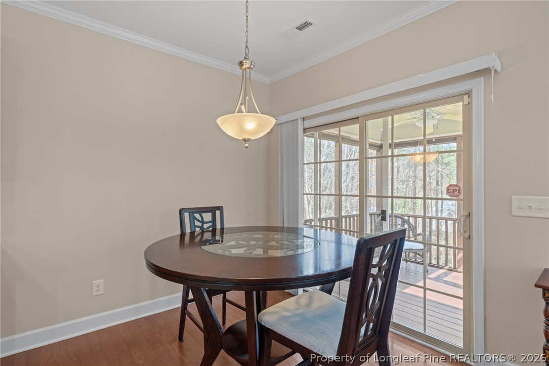 126 Pine Hawk Drive Spring Lake, NC 28390 - Photo 15 of 48 a view of a dining room with furniture window and outside view