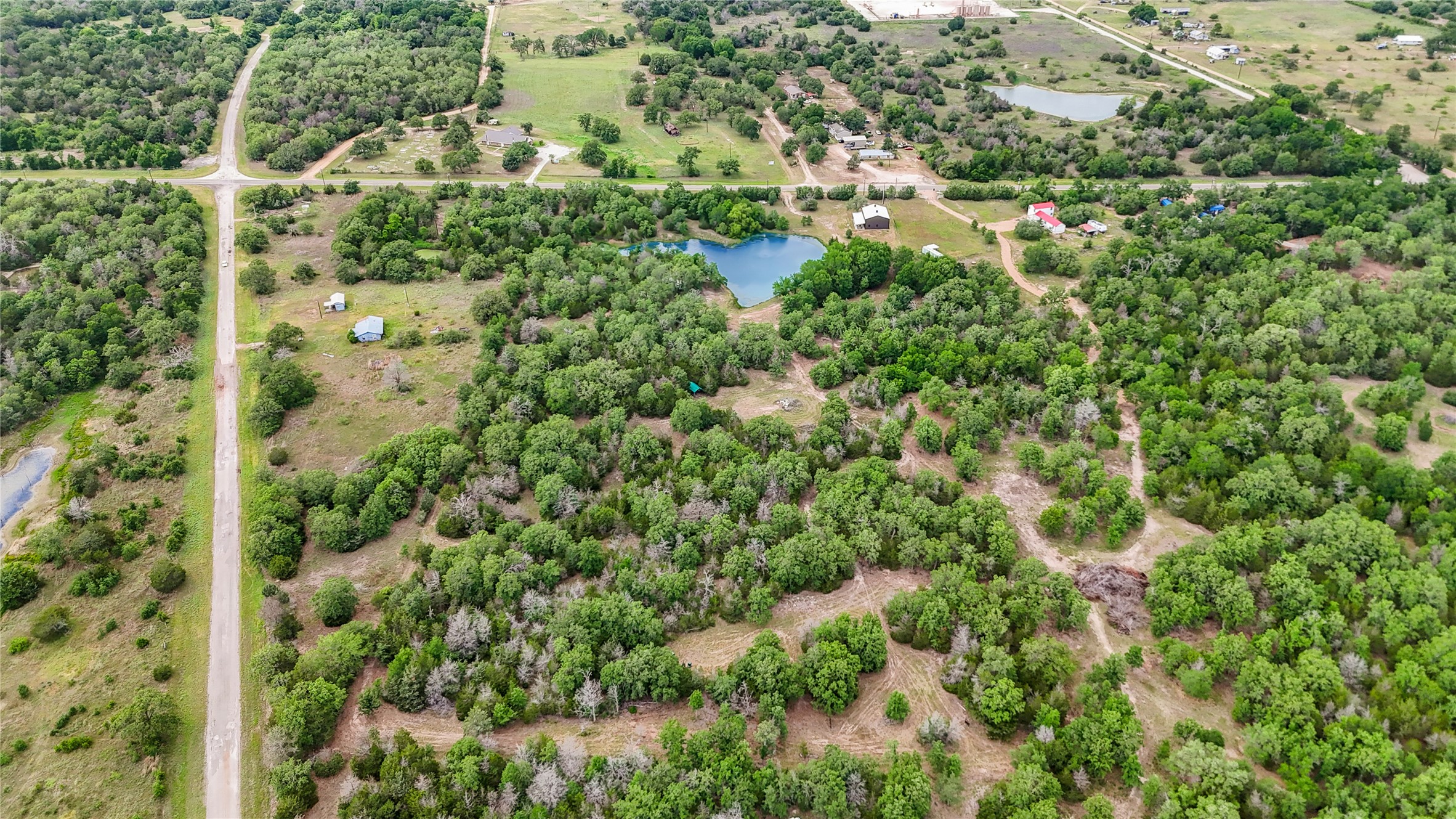 5837 FM 180 Road Ledbetter, TX 78946 - Photo 16 of 16 Aerial showing mulched trails throughout property. Fully fenced around perimeter!