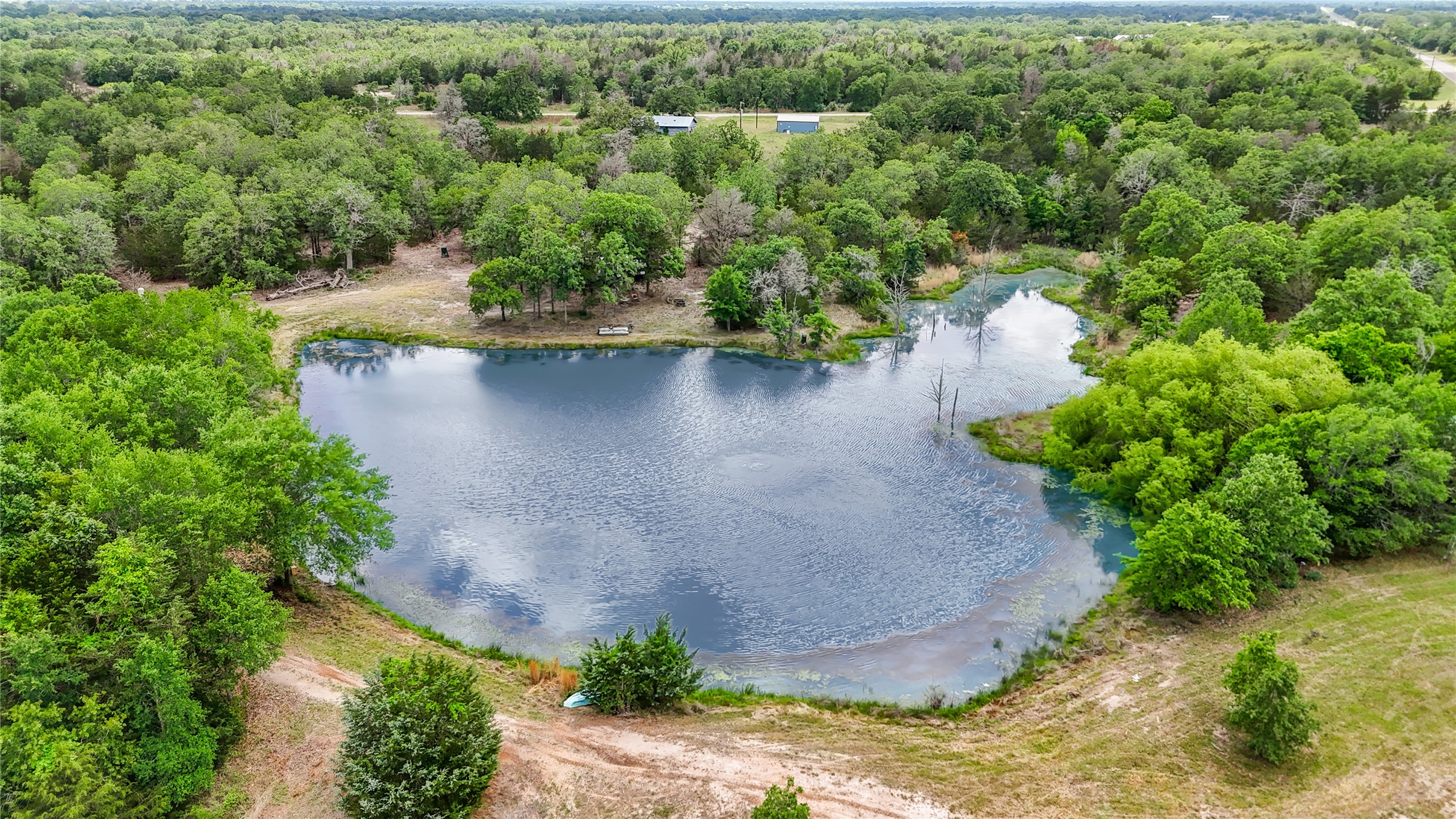 5837 FM 180 Road Ledbetter, TX 78946 - Photo 6 of 16 1.5 Acre Stocked Pond complete with aerator system small fishing boat.
