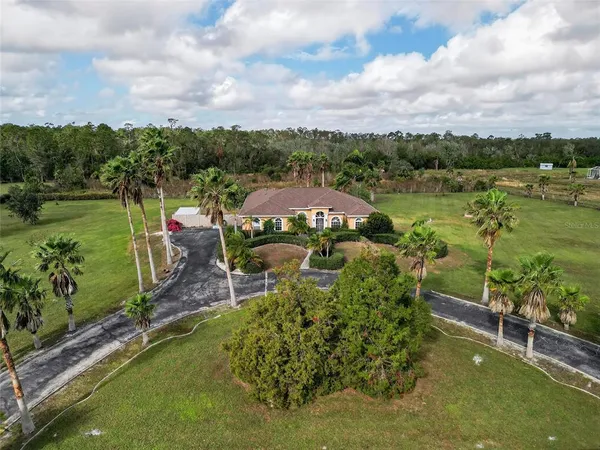 a view of a lake with a house in the background