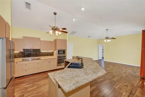 a kitchen with a table and chairs