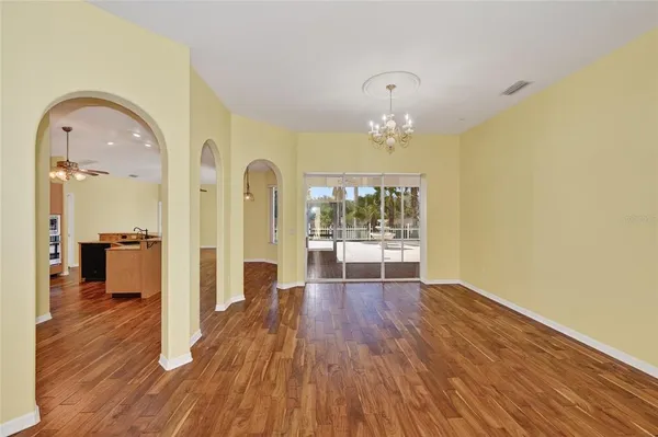a view of a living room with wooden floor