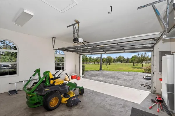an aerial view of residential house with outdoor space and lake view