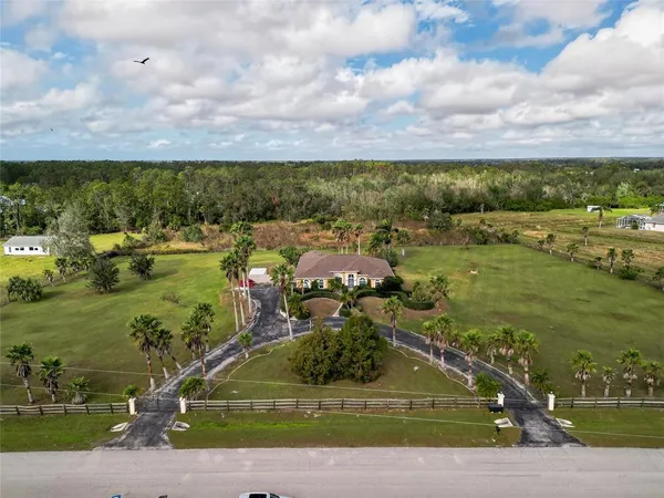 a view of a swimming pool with a yard