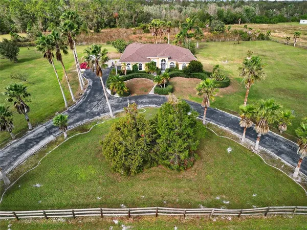 an aerial view of mountain with residential house