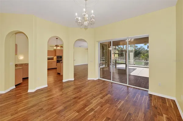 a view of a room with wooden floor and front door