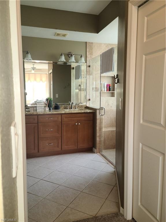 2255 Harmony Lane, Unit 8 Naples, FL 34109 - Photo 12 of 19 a kitchen with stainless steel appliances a sink and a refrigerator
