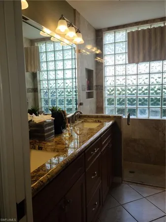 a kitchen with a large window and a sink