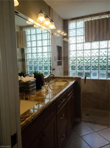 a kitchen with a large window and a sink