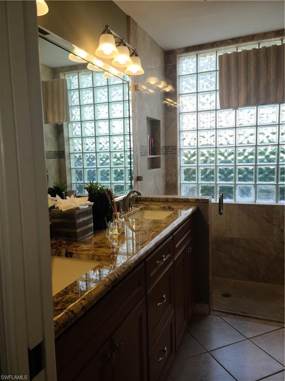 2255 Harmony Lane, Unit 8 Naples, FL 34109 - Photo 14 of 19 a kitchen with a large window and a sink