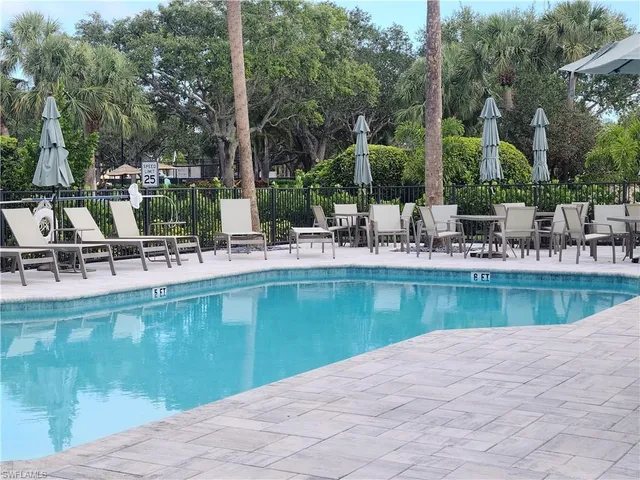 a view of a swimming pool with chairs