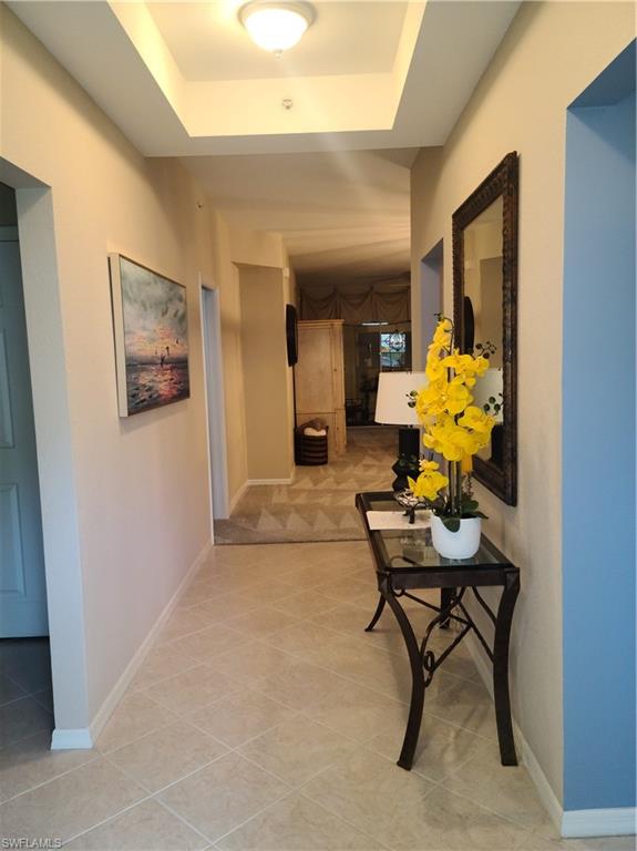 2255 Harmony Lane, Unit 8 Naples, FL 34109 - Photo 3 of 19 a dining room with furniture and a potted plant
