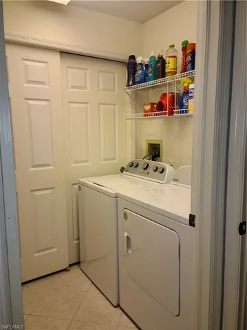 a utility room with washer and dryer