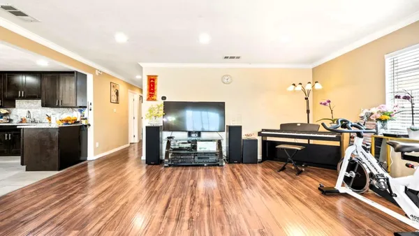 a view of a kitchen from a hallway