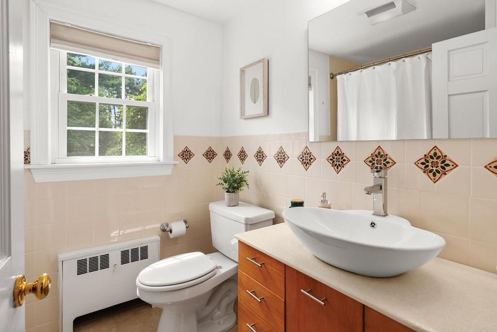 7 Dorothy Road Newton, MA 02459 - Photo 16 of 23 a bathroom with a sink and a toilet