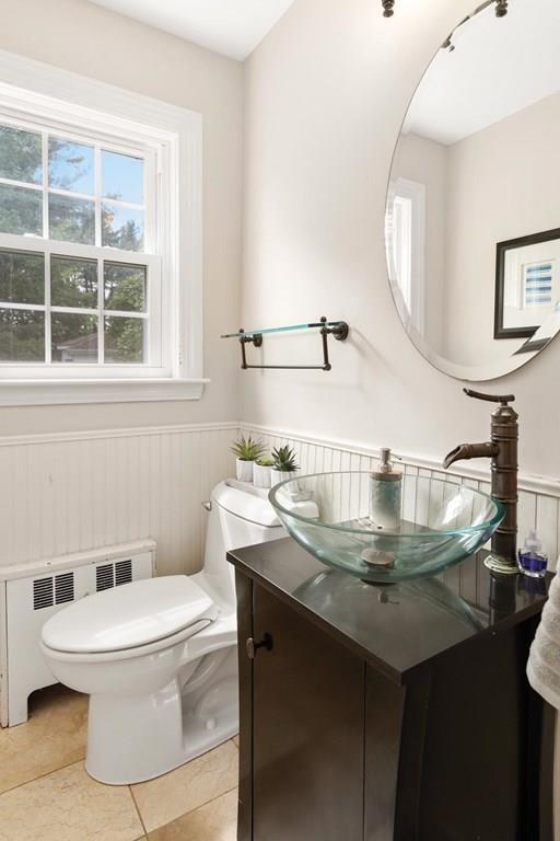 7 Dorothy Road Newton, MA 02459 - Photo 17 of 23 a bathroom with a sink a toilet and mirror