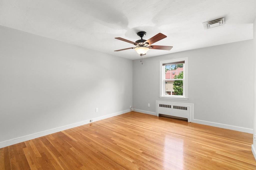 7 Dorothy Road Newton, MA 02459 - Photo 18 of 23 wooden floor in an empty room with a window