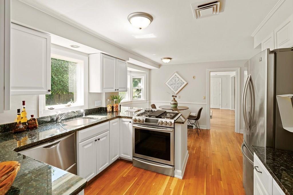 7 Dorothy Road Newton, MA 02459 - Photo 10 of 23 a kitchen with a stove a sink and a refrigerator