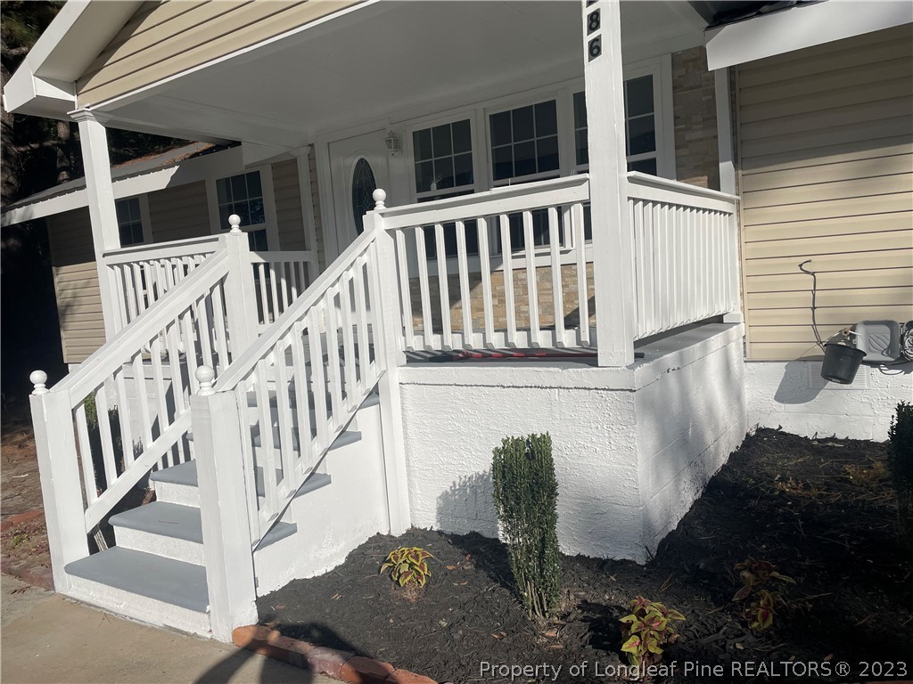 286 Doc Brown Road Raeford, NC 28376 - Photo 3 of 12 a view of a house with porch and wooden floor