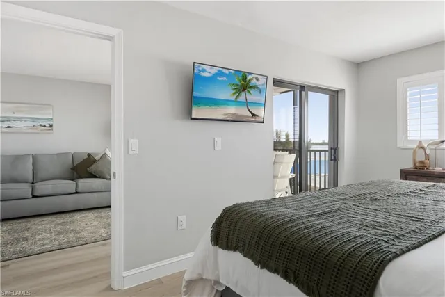 a bedroom with a bed and a couch