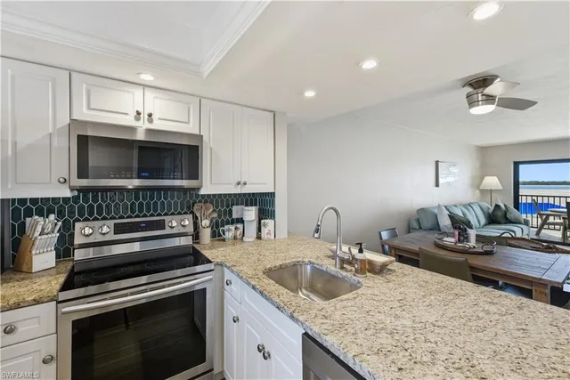 a kitchen with a stove and a sink