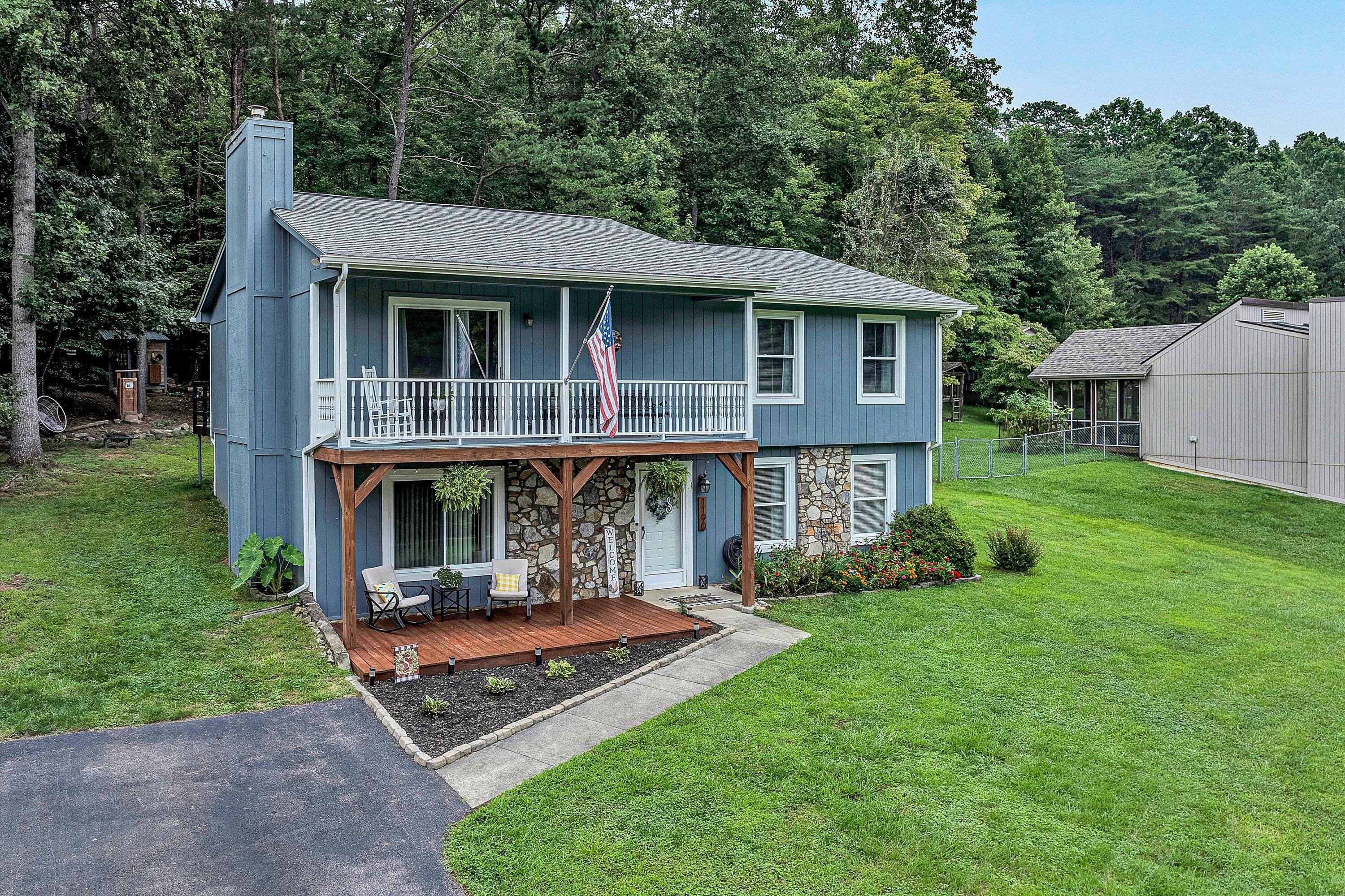 a view of a house with backyard porch and garden