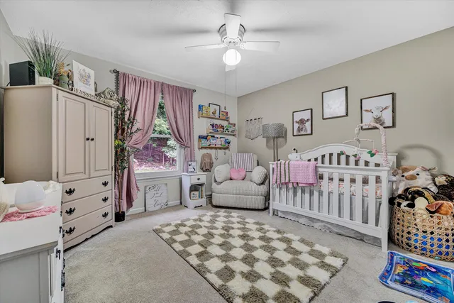 a bedroom with a large bed and flat tv