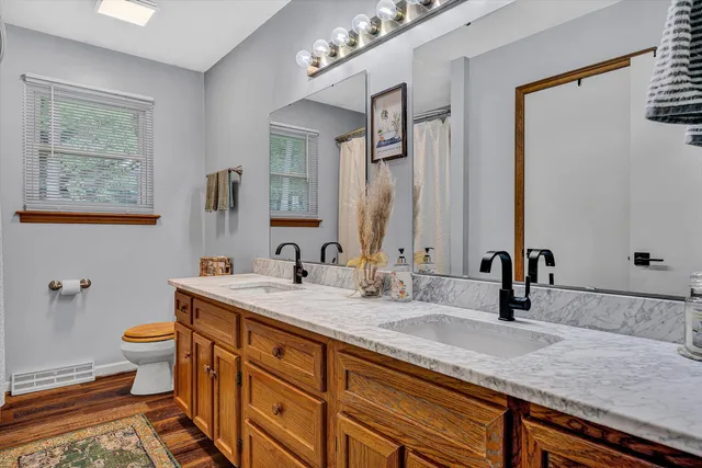 a bedroom with furniture and a baby crib