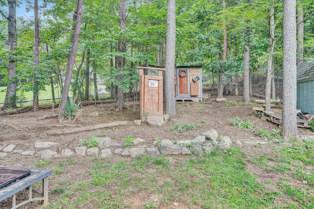 a backyard of a house with lots of green space