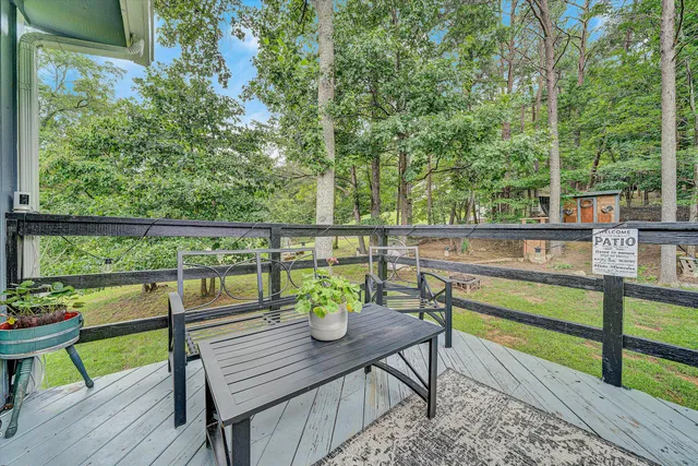 a view of a chairs and table on the deck