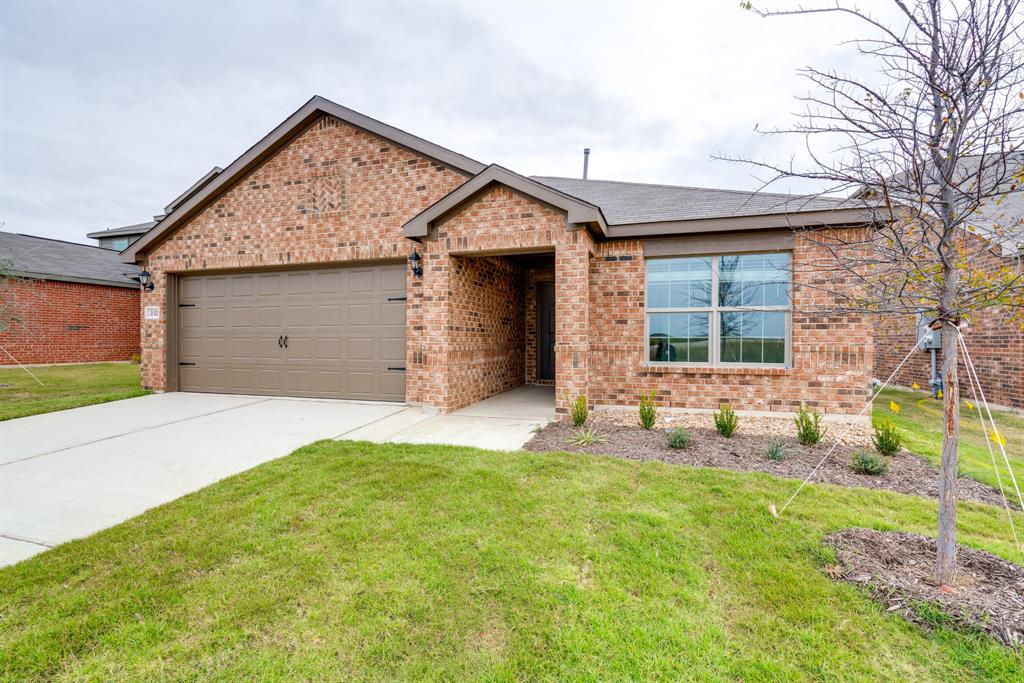 a view of a house with backyard and porch