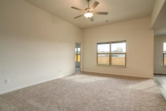 a view of a kitchen with a sink and a refrigerator
