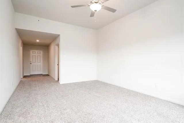 an empty room with closet area
