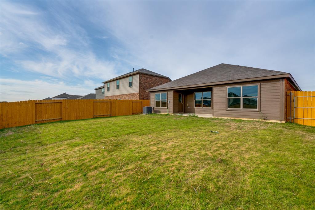 232 Micah Lane Ferris, TX 75125 - Photo 5 of 32 a front view of a house with a garden