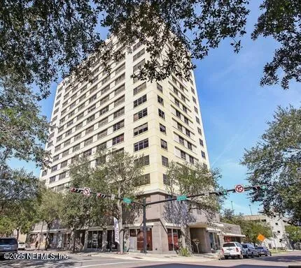 a view of a living room and chandelier