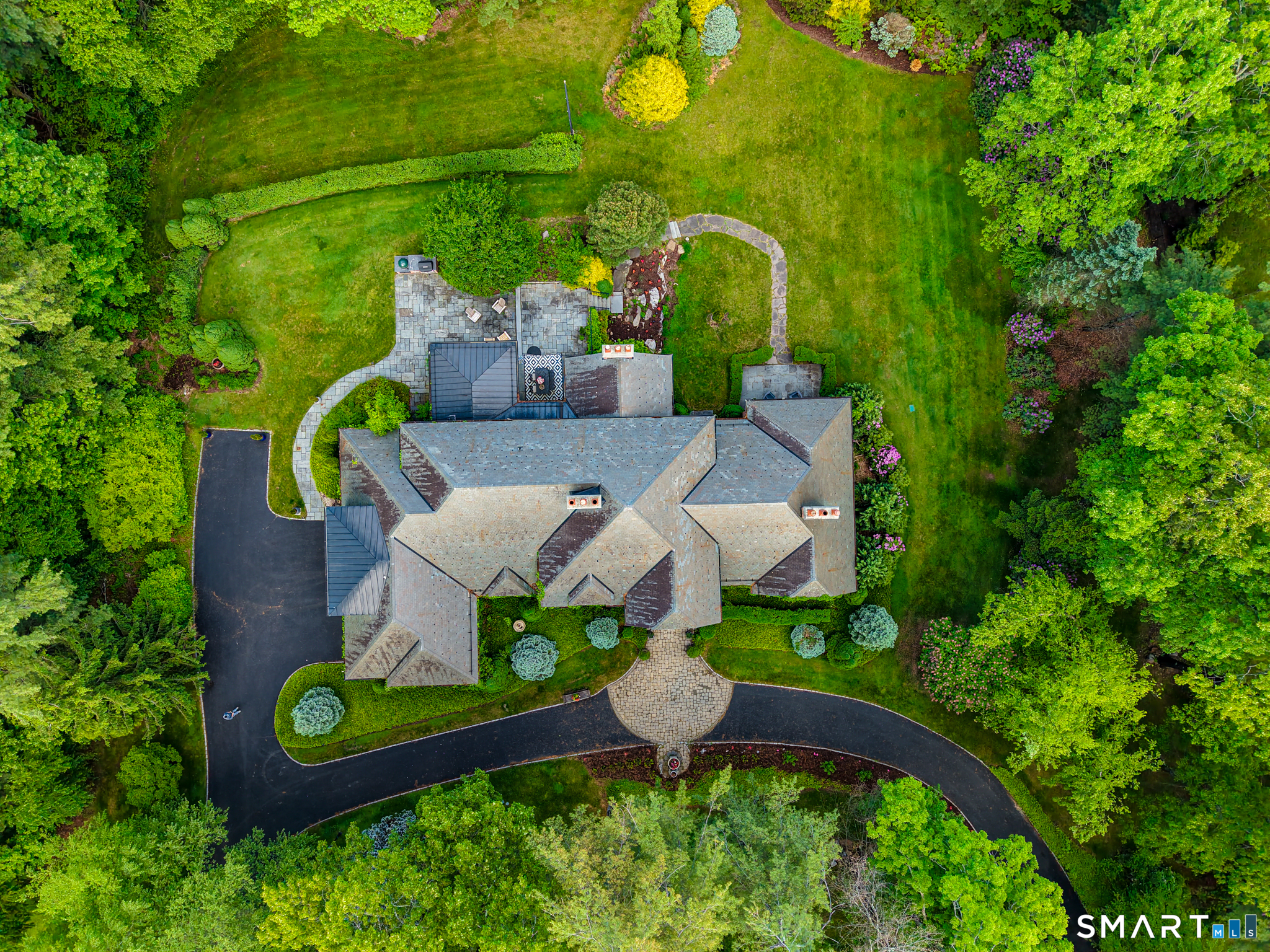 14 Robkins Road Avon, CT 06001 - Photo 2 of 40 an aerial view of a house with a garden and outdoor seating
