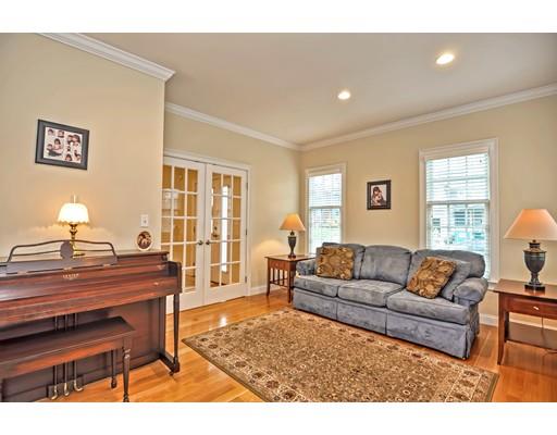 82 Edwardel Road Needham, MA 02492 - Photo 11 of 25 a living room with furniture a dining table and a piano table with wooden floor