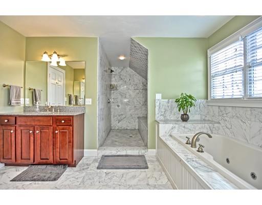 82 Edwardel Road Needham, MA 02492 - Photo 13 of 25 a bathroom with a granite countertop tub a sink and a large mirror