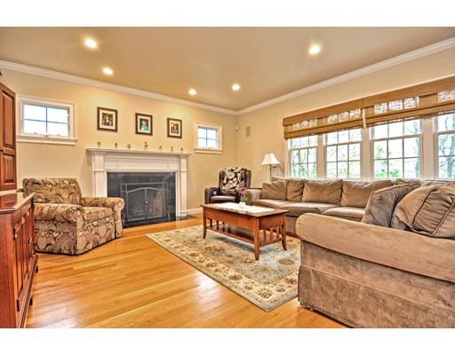 82 Edwardel Road Needham, MA 02492 - Photo 8 of 25 a living room with furniture and a fireplace