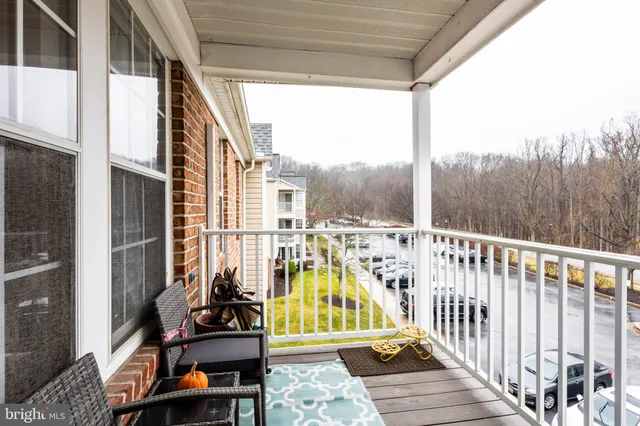 a view of a balcony with chairs