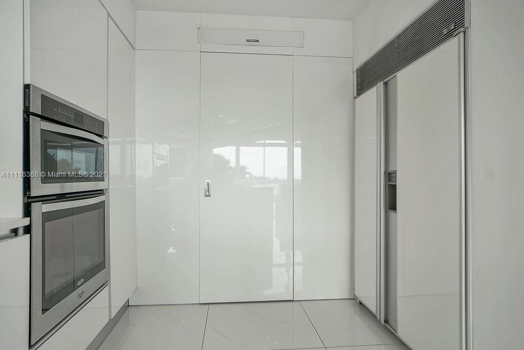 2127 Brickell Avenue, Unit 503 Miami, FL 33129 - Photo 15 of 54 a view of a kitchen from the hallway with hallway