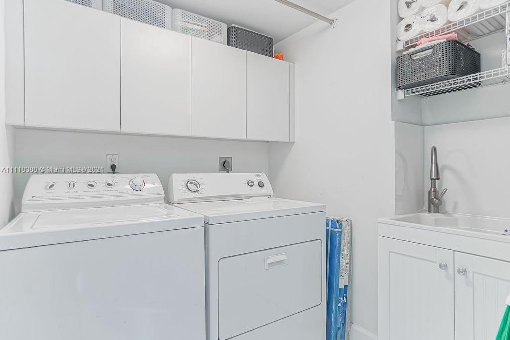 2127 Brickell Avenue, Unit 503 Miami, FL 33129 - Photo 16 of 54 a utility room with dryer and washer