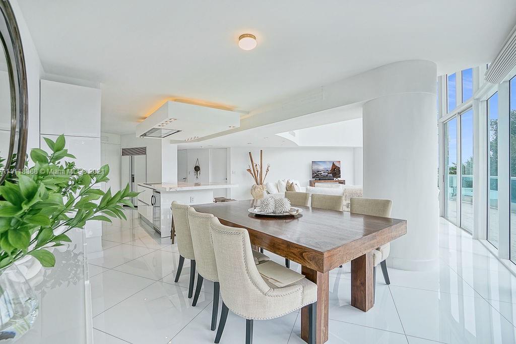 2127 Brickell Avenue, Unit 503 Miami, FL 33129 - Photo 17 of 54 a view of a dining room with furniture and wooden floor