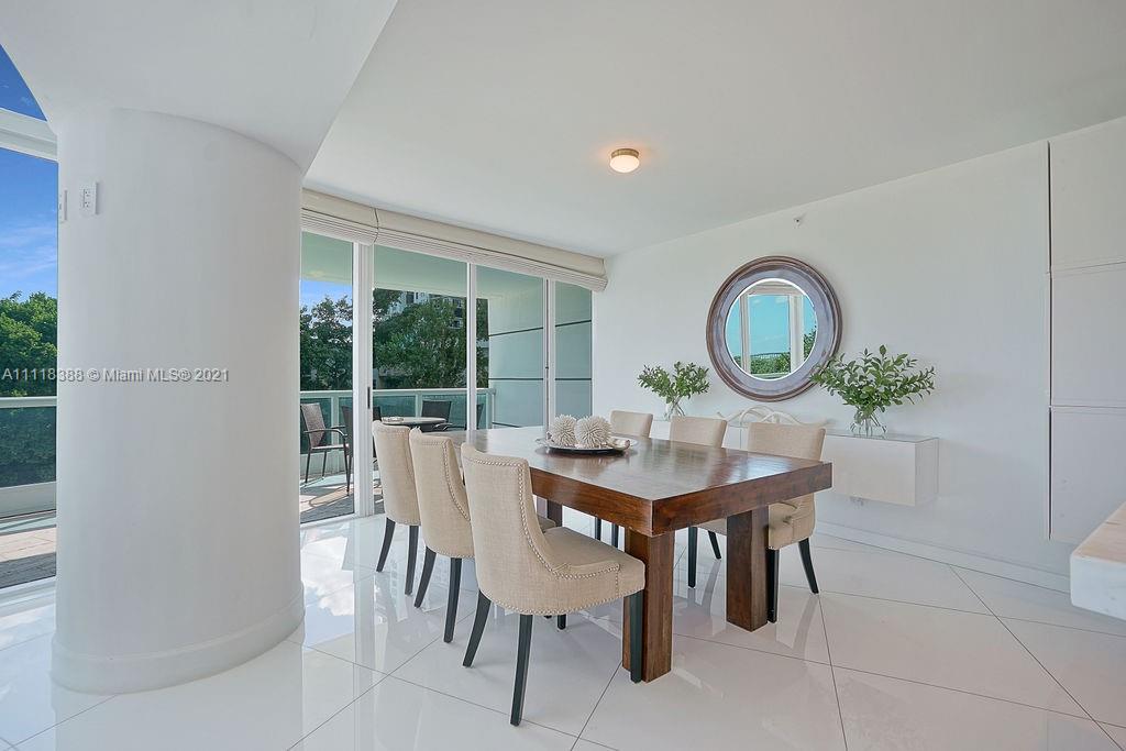 2127 Brickell Avenue, Unit 503 Miami, FL 33129 - Photo 18 of 54 a view of a dining room with furniture and a large window