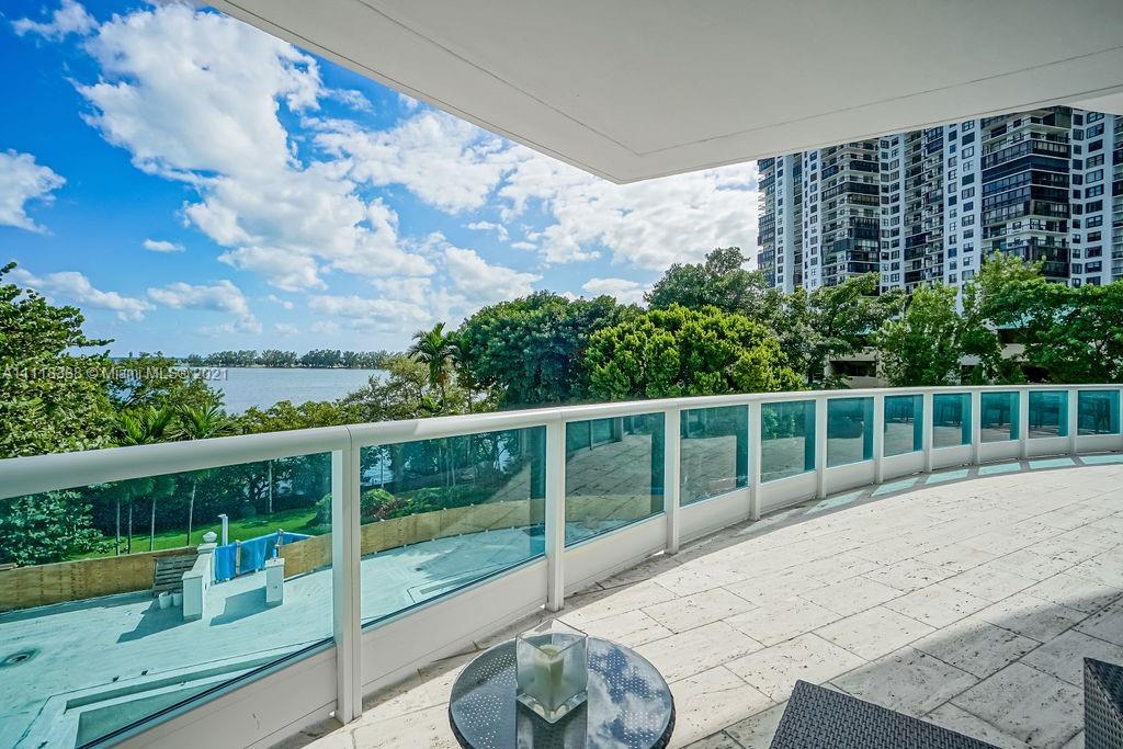 2127 Brickell Avenue, Unit 503 Miami, FL 33129 - Photo 20 of 54 a balcony with wooden floor and outdoor space