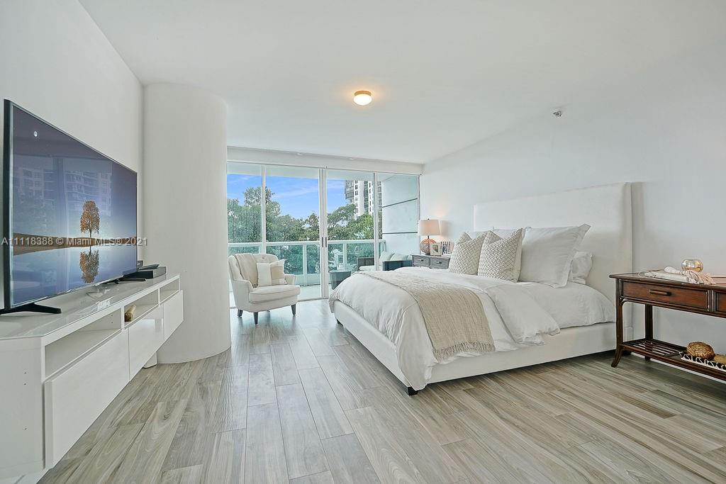 2127 Brickell Avenue, Unit 503 Miami, FL 33129 - Photo 23 of 54 a bedroom with a bed and a view of kitchen